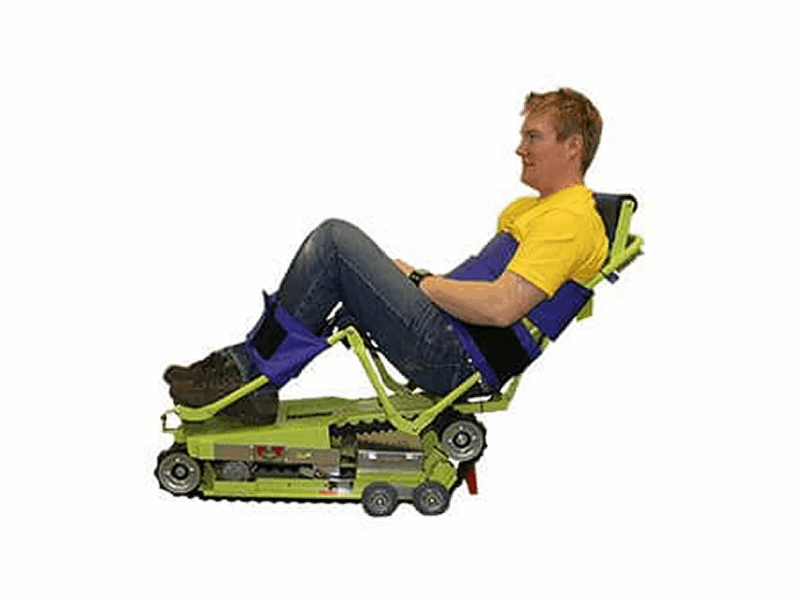 Man using a staircase chair lift or emergency evacuation chair. A specialized residential lift for accessibility.