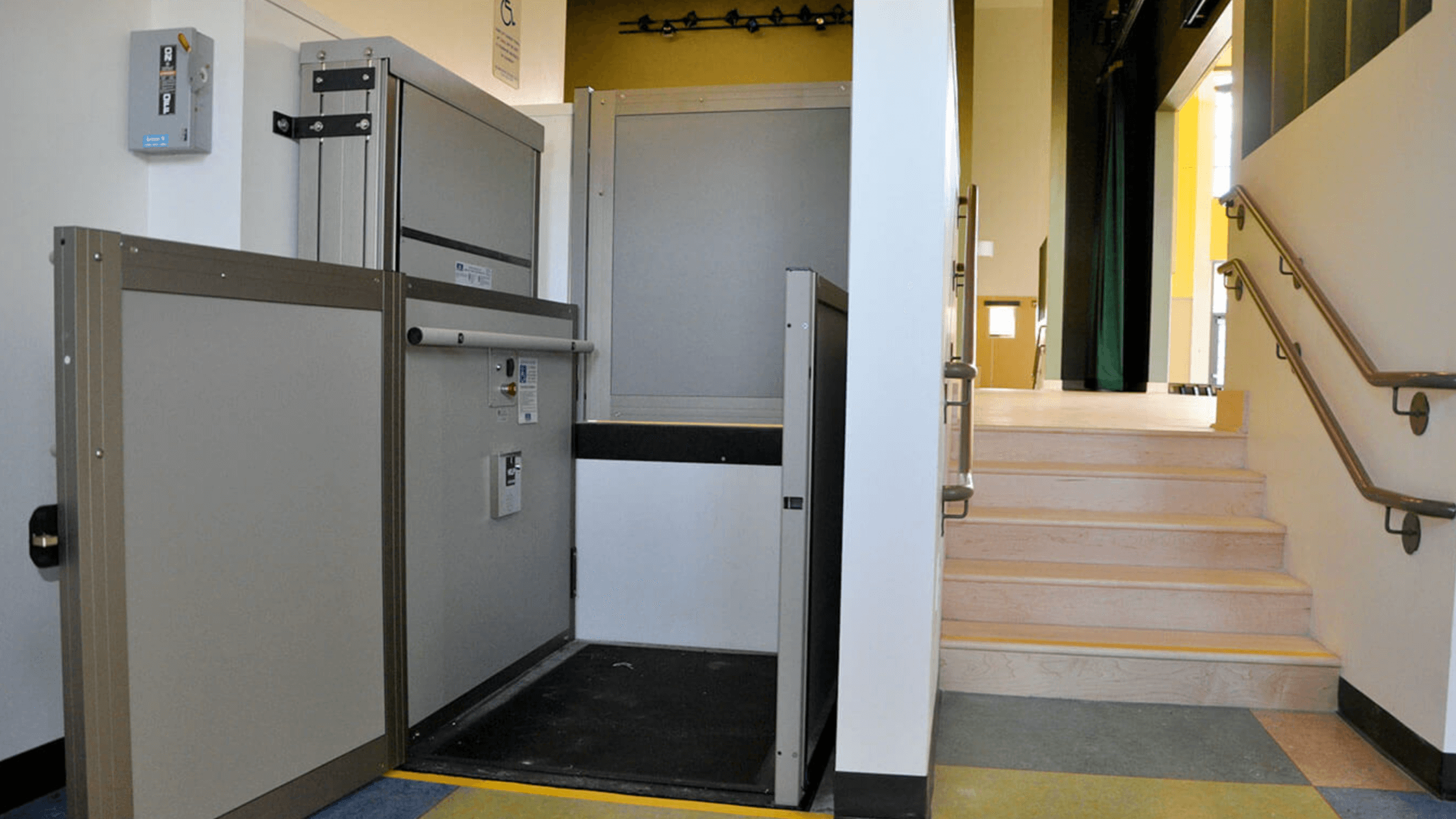 Genesis OPAL vertical platform lift providing low-rise accessibility in a North Texas commercial building