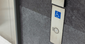 Vertical platform lift installed at a commercial building entrance to improve ADA accessibility in North Texas