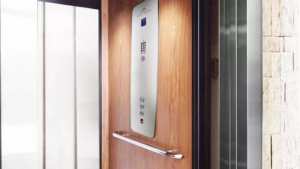 An Elvoron home elevator cab and control panel, illustrating the manual lowering and battery backup safety systems used during a power outage
