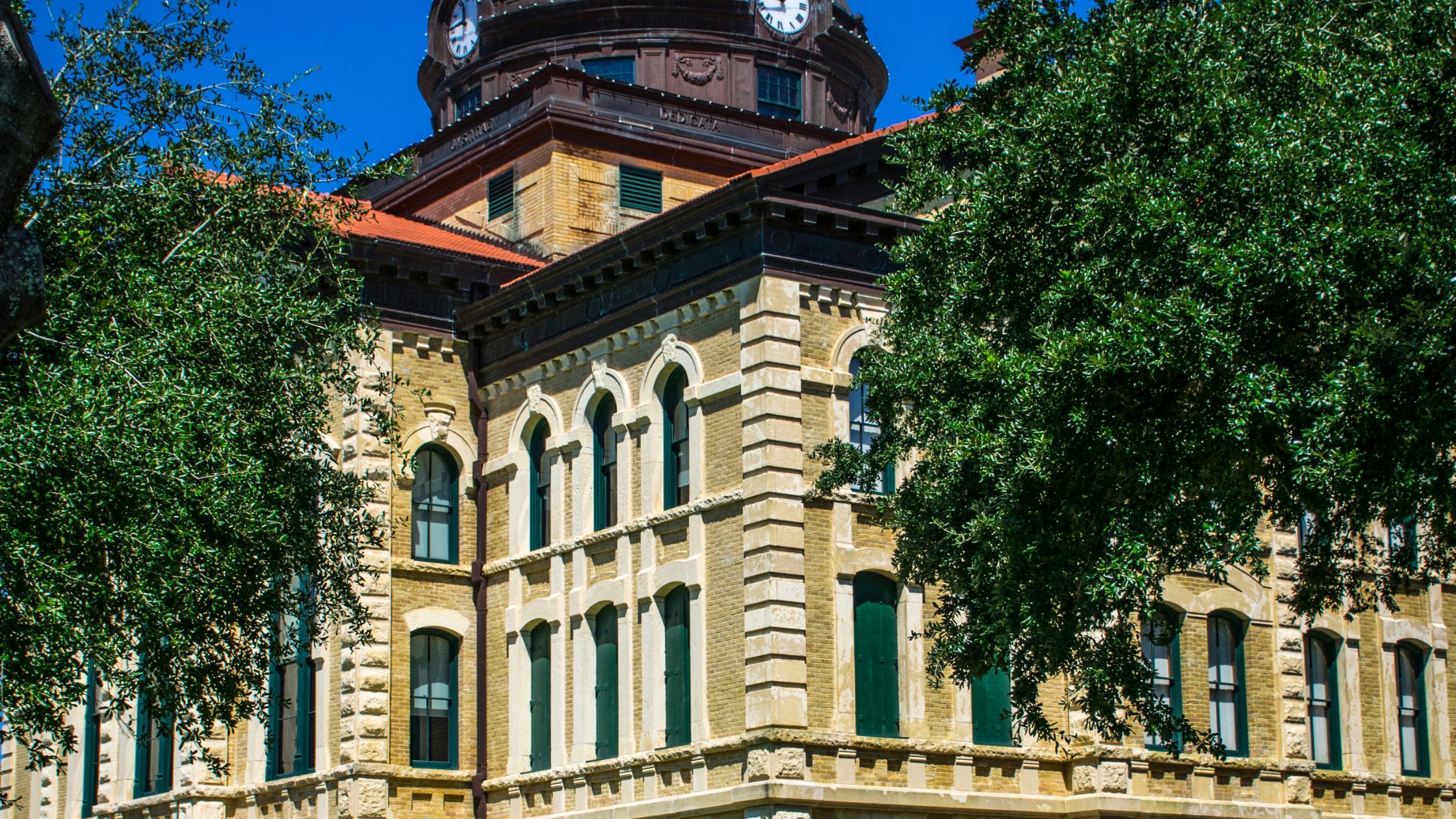 A discreet LU/LA elevator installed inside a historic North Texas building, preserving the original facade and character-defining features