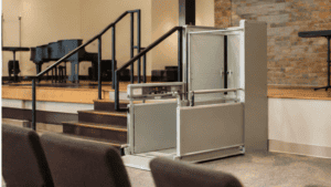 A vertical platform lift installed at a school entrance, part of a planned accessibility project for a North Texas school or church